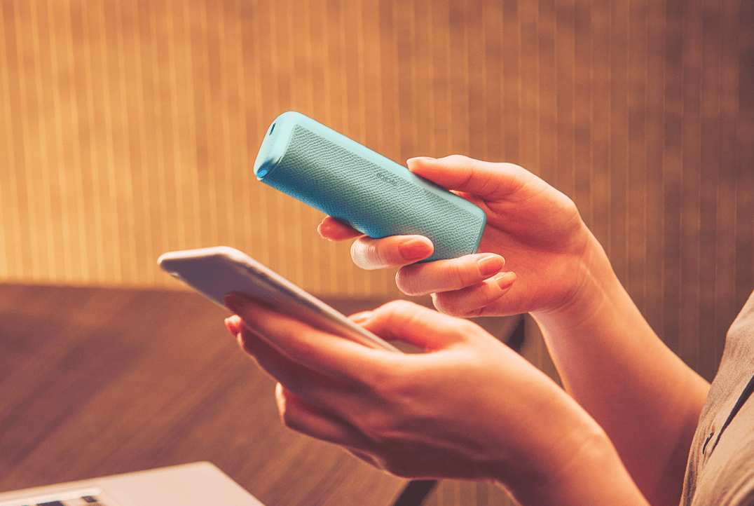 Woman looking at IQOS packaging