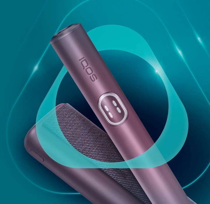 A jade green IQOS ILUMA PRIME device.