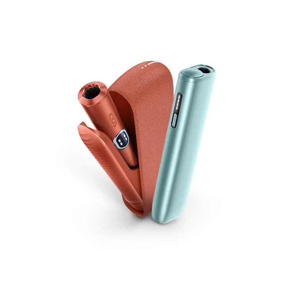 IQOS ILUMA i devices in Vivid Teracotta and Breeze Blue, and IQOS ILUMA i accessories on a sunset ocean IQOS key