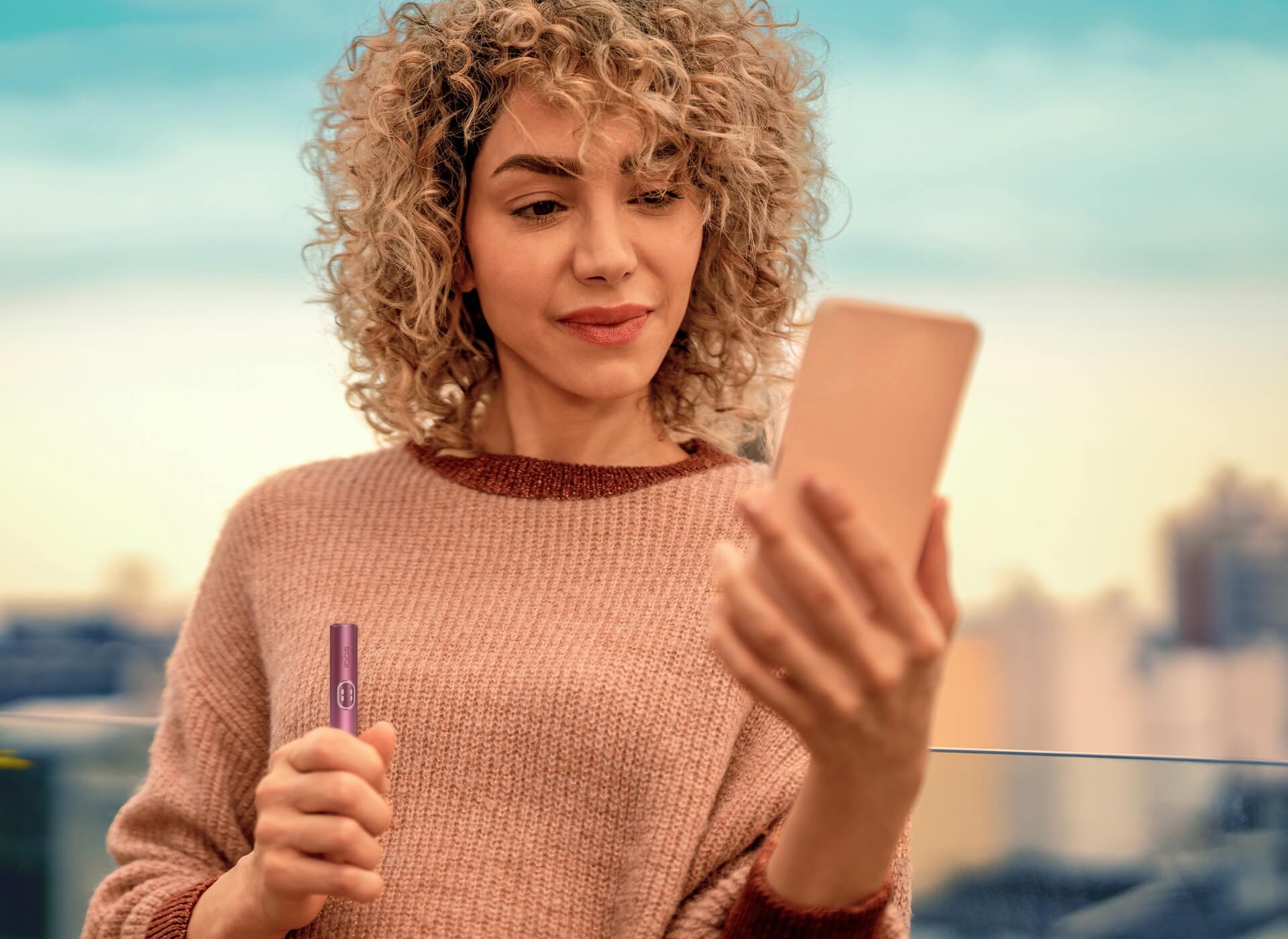 A person holding a mobile phone.