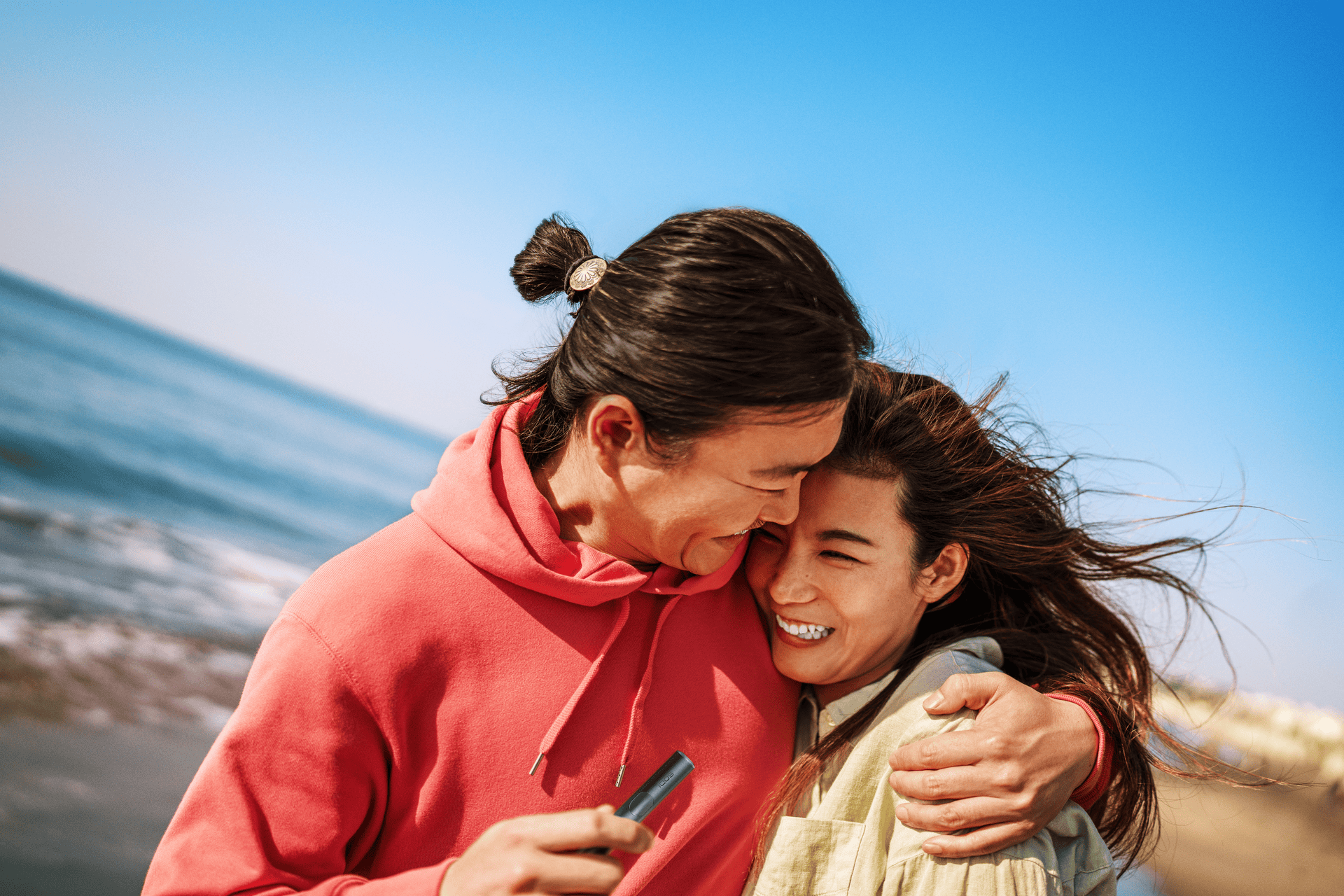 couple hugging on the beach