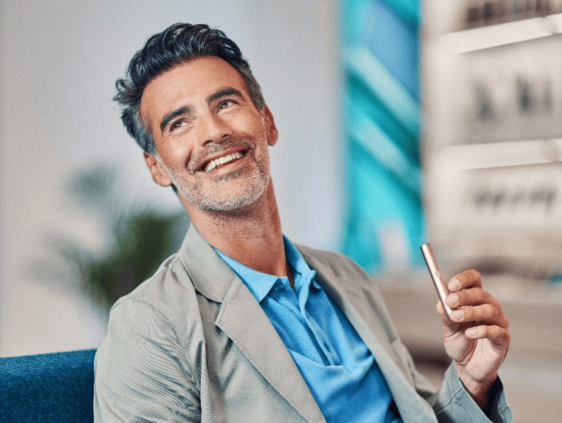 A man, happy with his IQOS