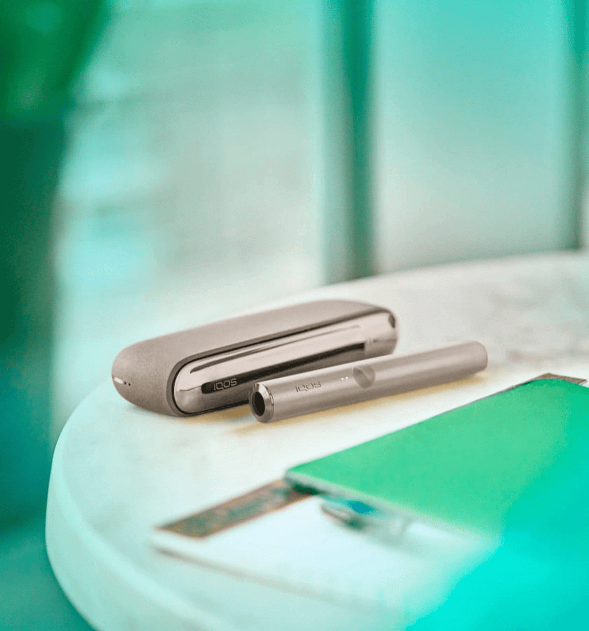 A gray IQOS on the table