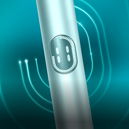 Detalhe de dispositivo IQOS ILUMA i PRIME Azul Claro, orientado para a esquerda, irradiando um padrão oval concêntrico, sobre fundo turquesa escuro